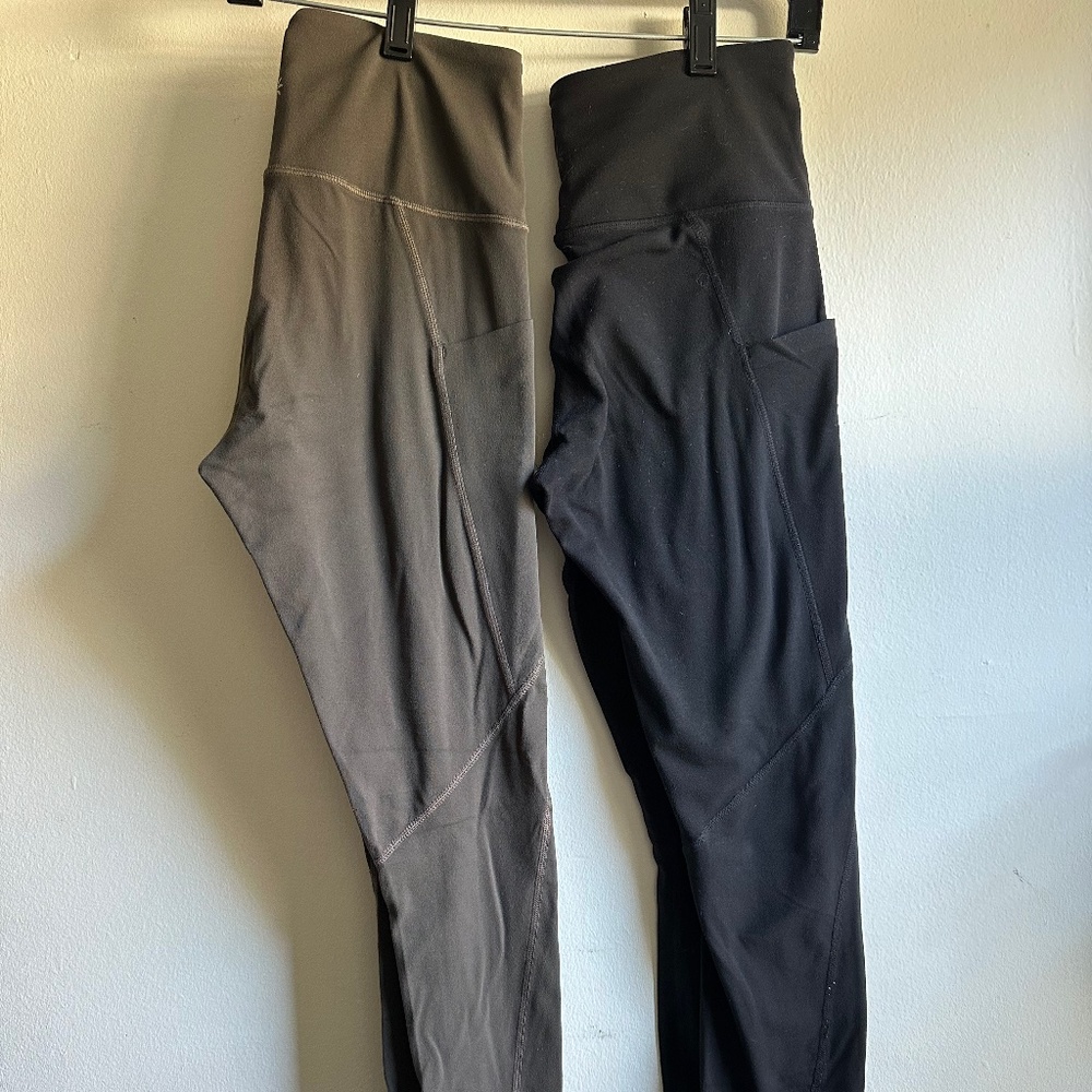 Two Athleta Salutation 7/8 Stash Pocket Tights in Black and Greenish-Gray, XS